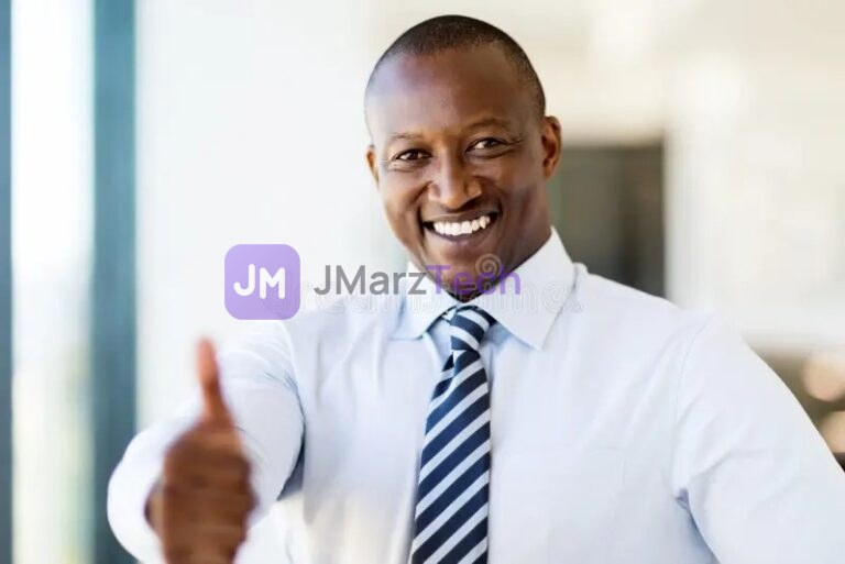 Man in shirt and tie giving a thumbs up